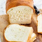A loaf of bread with some slices